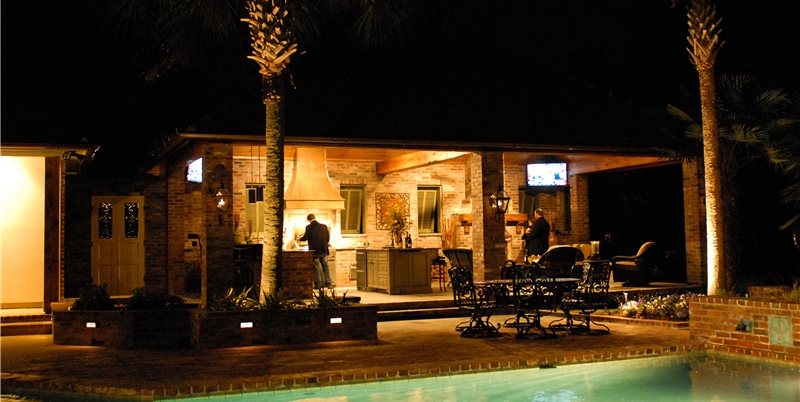 covered outdoor kitchen at night