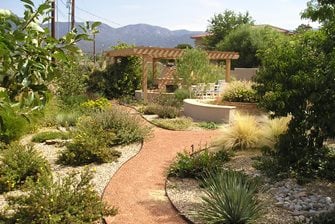 backyard xeriscape, pergola fireplace