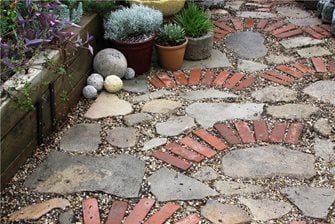 mosaic of recycled paving materials